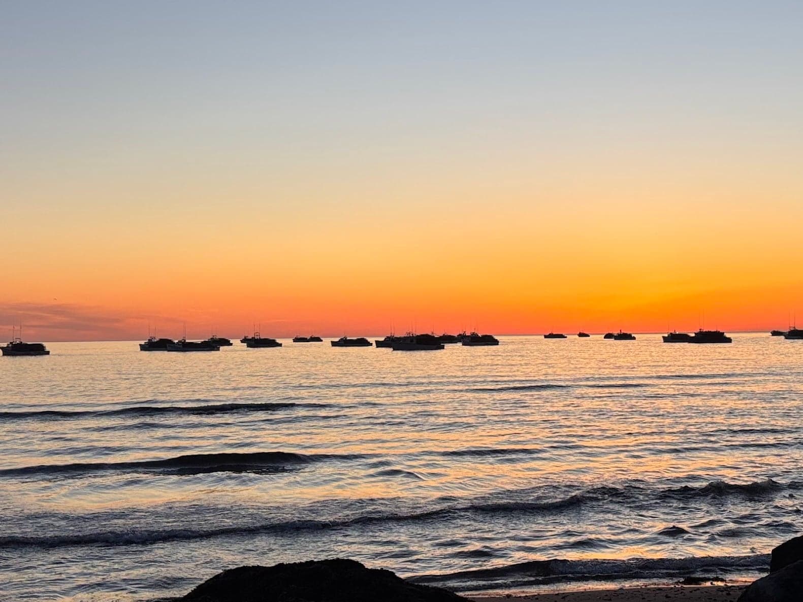 Fishing boats gathered on the water off North Rustico at sunrise